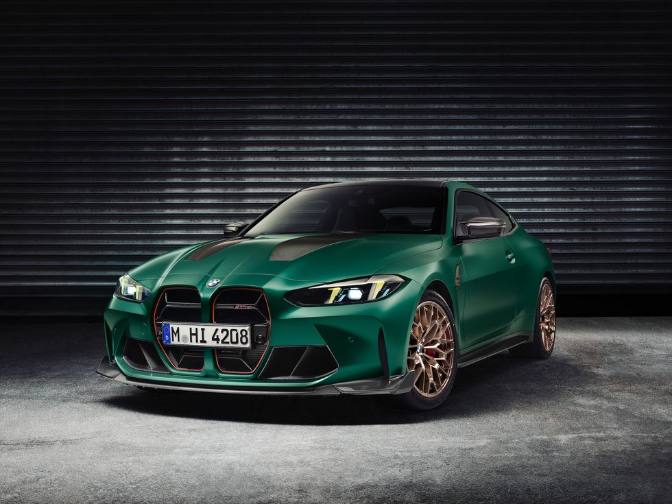 BMW M4 CS in green with gold wheels, showcasing its aggressive front design and carbon-fiber details