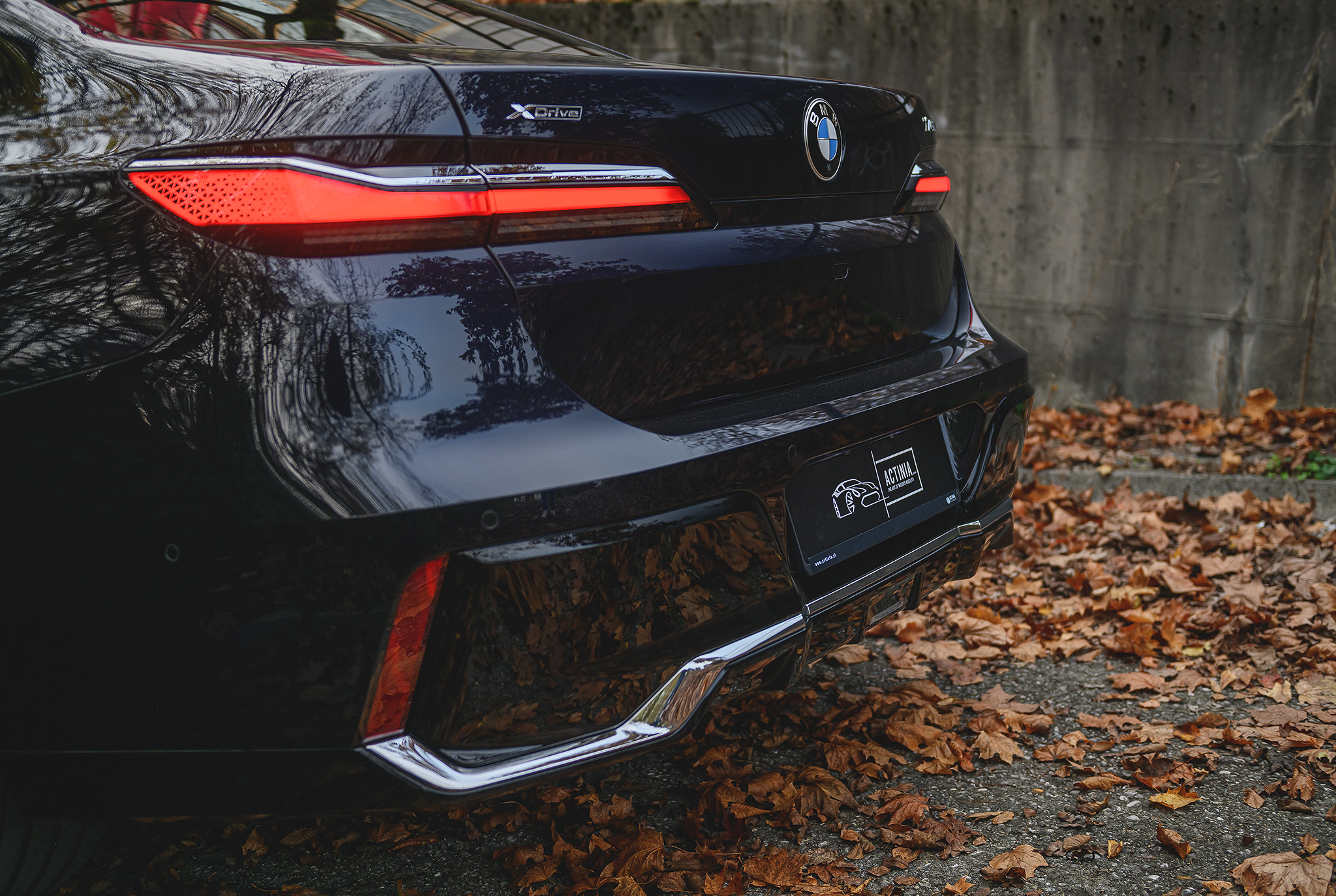 BMW 740d rear view with LED taillights and xDrive badge, highlighting elegant design and premium executive styling