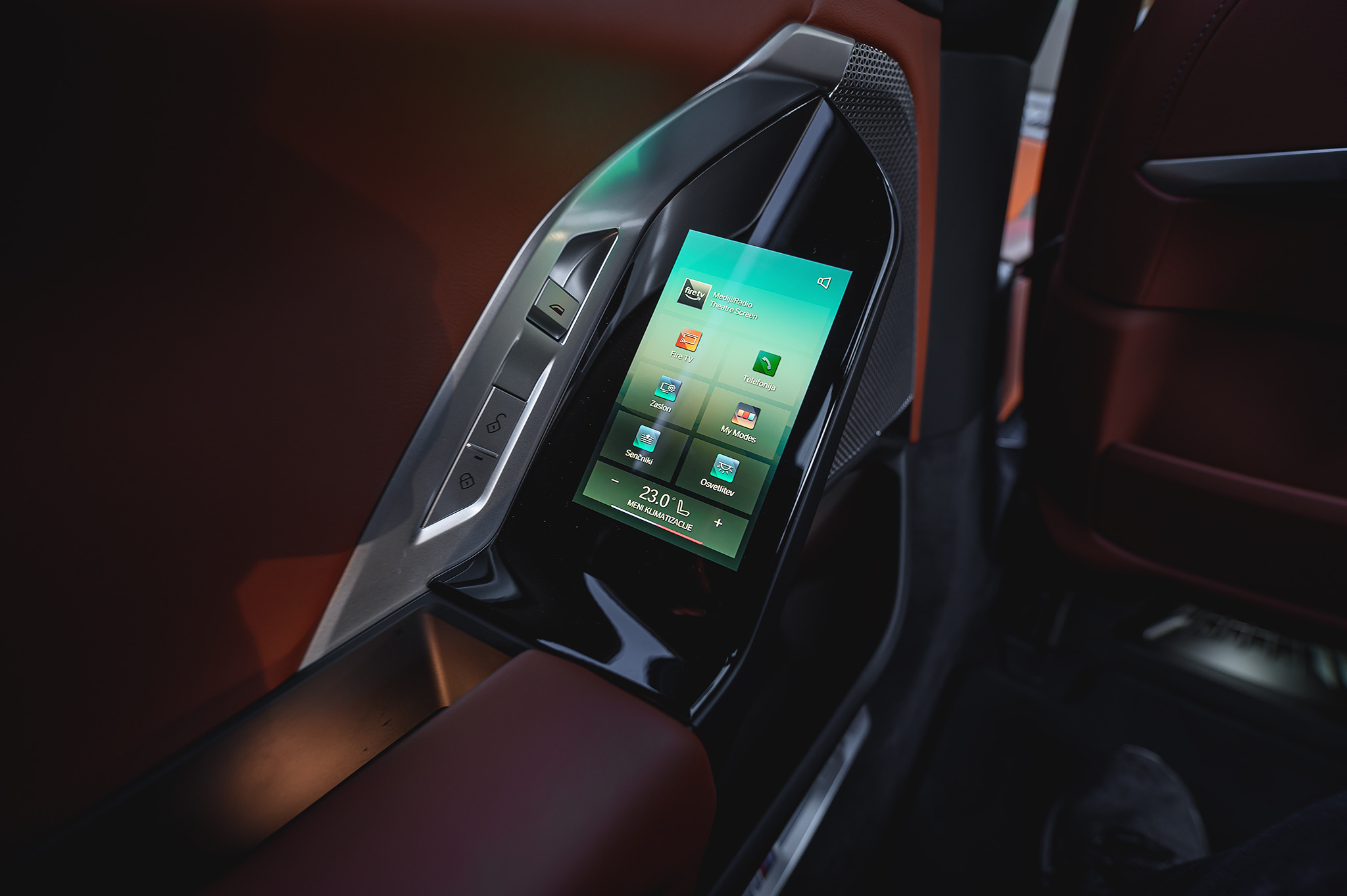 BMW 740d rear-seat touchscreen controller, highlighting Theatre Screen controls and premium passenger comfort features