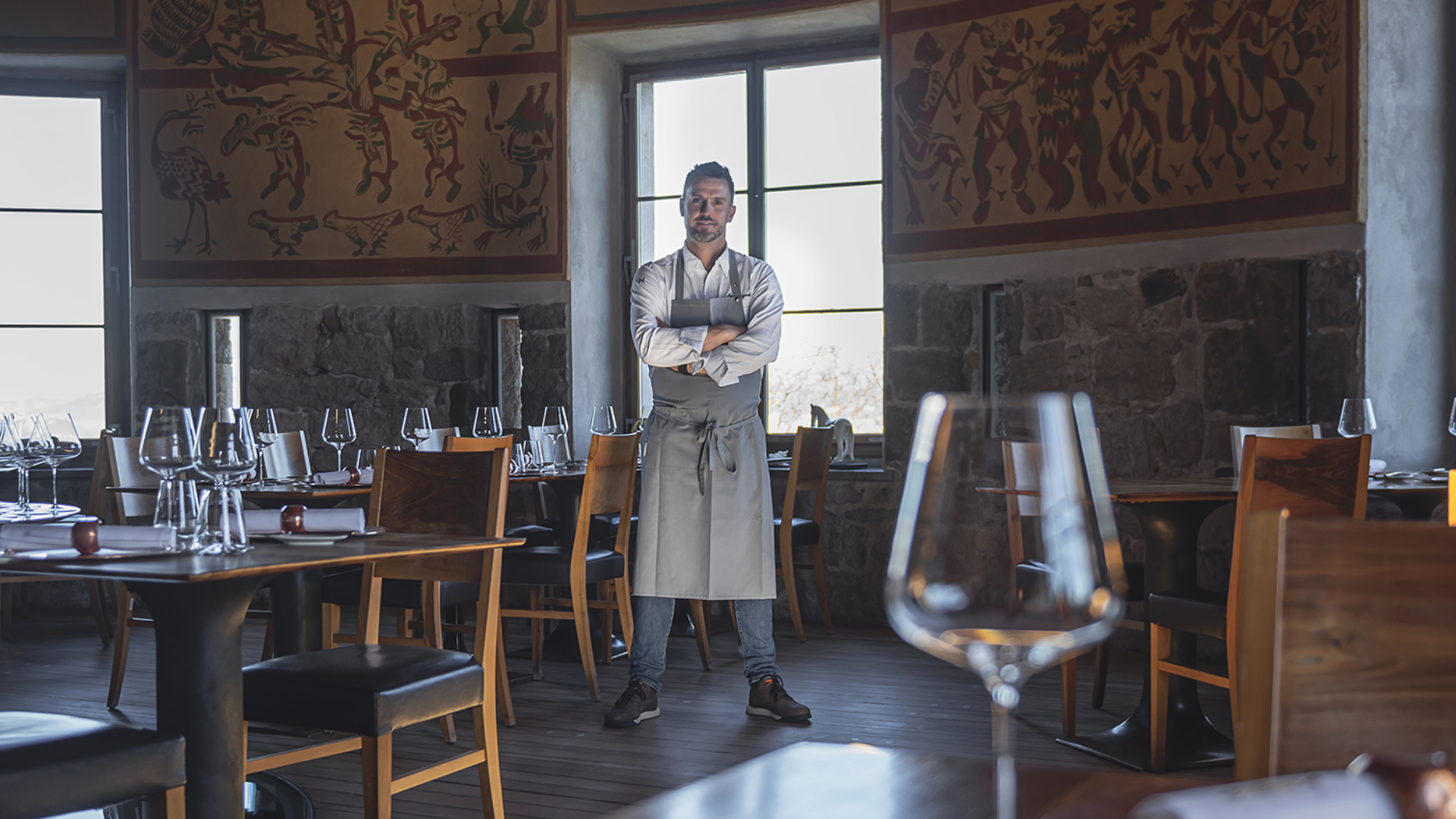 Chef standing inside Strelec restaurant, fine dining interior showcasing a culinary experience Slovenia
