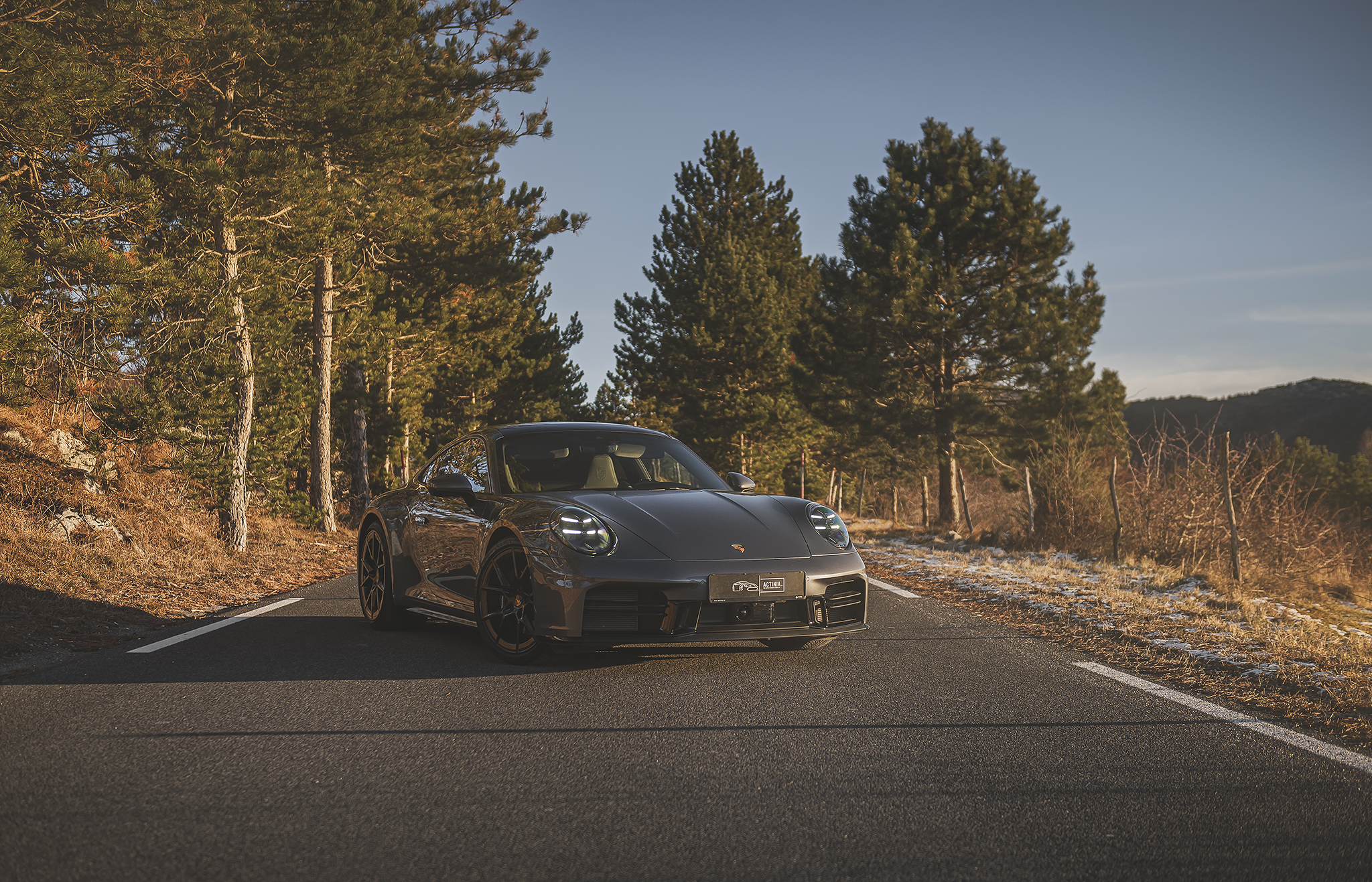 Luxury sports car driving through scenic roads in Slovenia, part of a luxury car and dining experience Slovenia